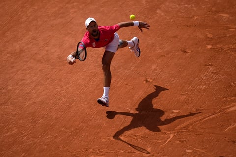 Novak Djokovic returns the ball Carlos Alcaraz